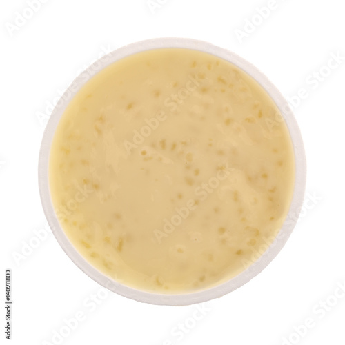 Top view of tapioca pudding in an opened container isolated on a white background.