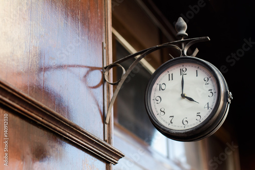 vintage clock on a wooden wall
