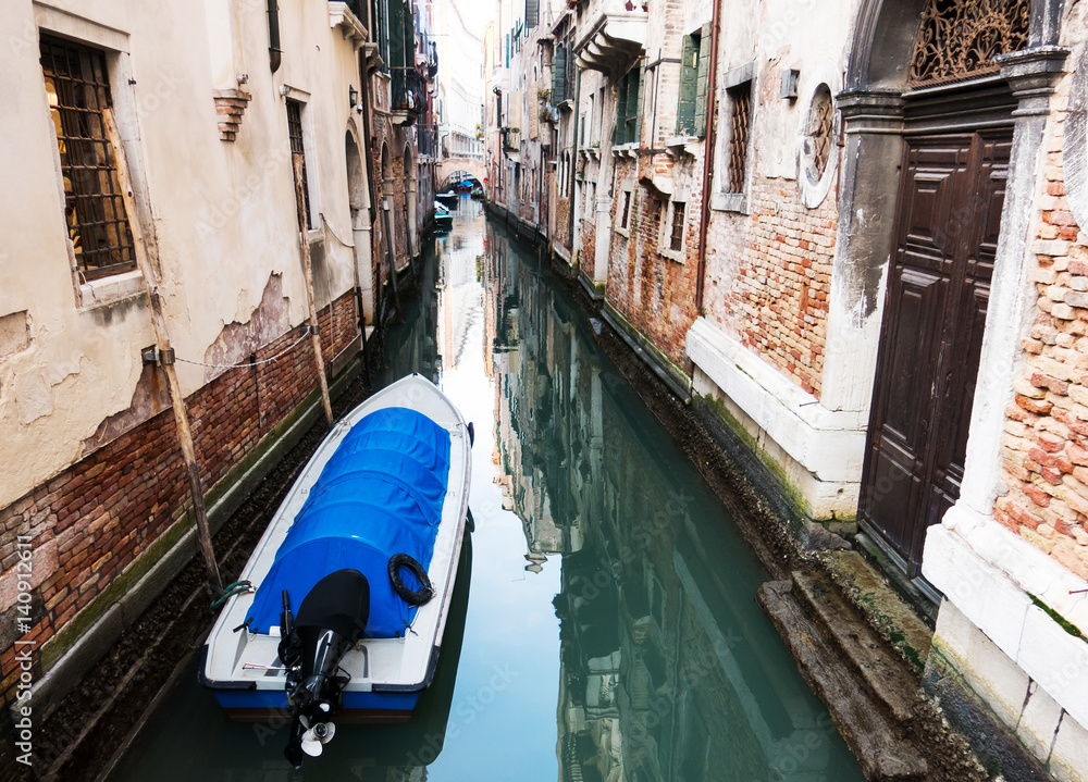  boat on a canal of Venice, Italy