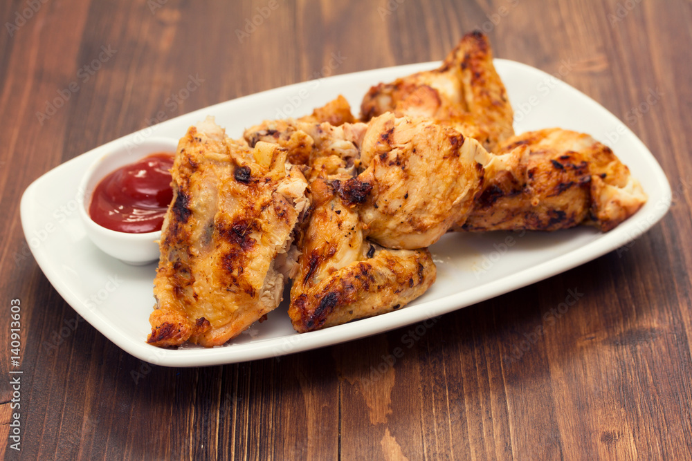 grilled chicken with sauce on dish grilled chicken with sauce on dish