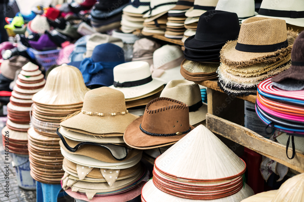 Variety of men and women hats at street market