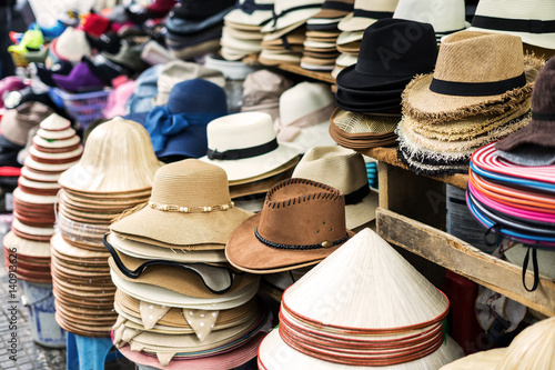 Variety of men and women hats at street market