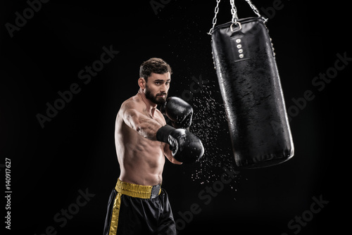 Boxer with punching bag © LIGHTFIELD STUDIOS