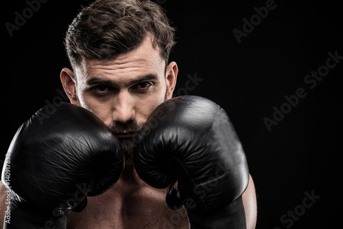 Sportsman in boxing gloves © LIGHTFIELD STUDIOS