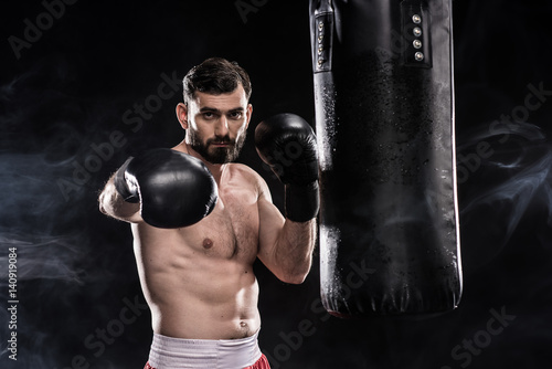 Boxer with punching bag