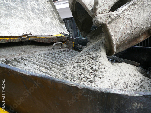 Concrete mix pouring into hopper photo