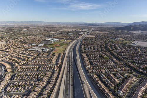 Aerial view of desert suburban sprawl along the 215 freeway in the Summerlin area of Las Vegas, Nevada.