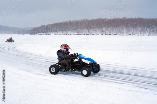 Winter karting competition on the ice track 