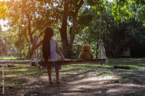 Girl holding a bear, swing bear 