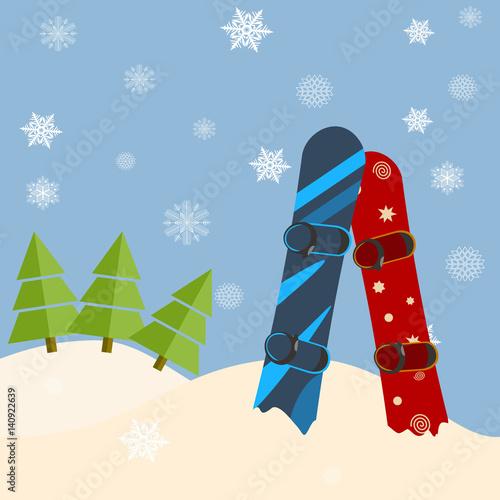 Fir trees, snowboards, hills. Winter bright day, blue sky, snow falling.