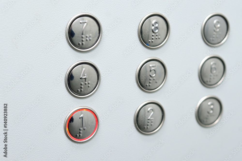 Button lift Braille accessible to the blind. Stock-Foto | Adobe Stock