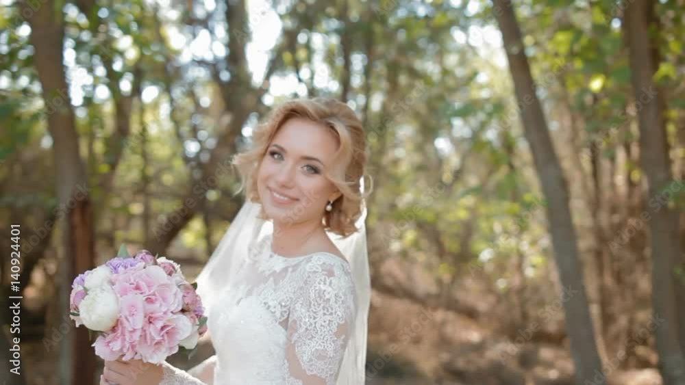 Beautiful caucasian bride spinning around holding her wedding dress and bouquet. Beautiful caucasian bride spinning around holding her wedding dress and bouquet.