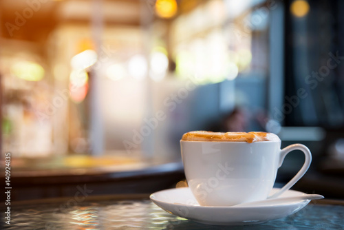 Cup of cappuccino in coffee shop 