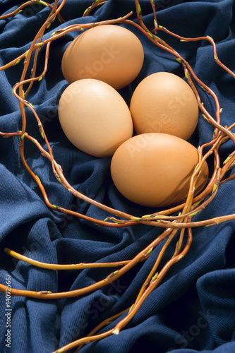 4eggs on blue fabric photo