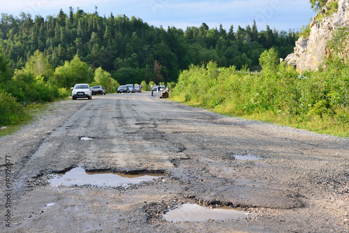 hole in the asphalt, bad road, the risk of movement by car