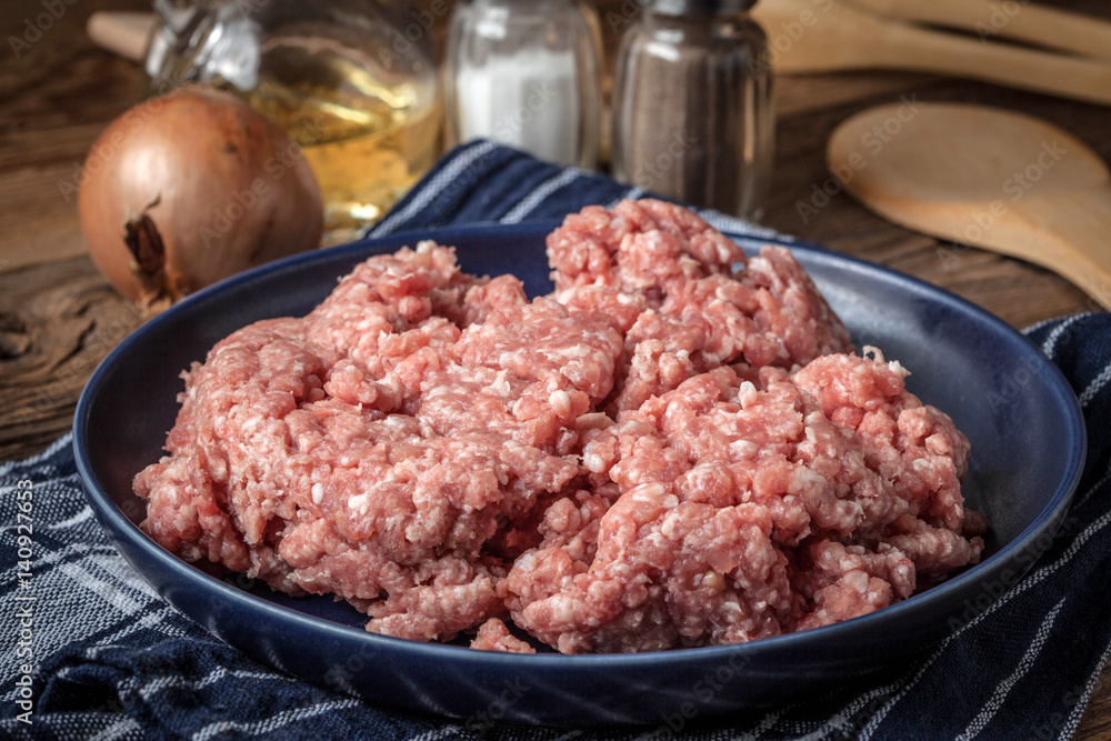 Minced meat on wooden background. Minced meat on wooden background.
