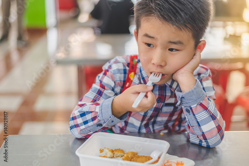Little Boy boring to eat.
