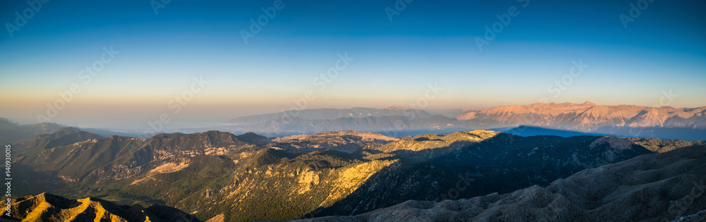 view from the top of Tahtali Mountain Range during sunrise on sea and valley, Turkey, Kemer