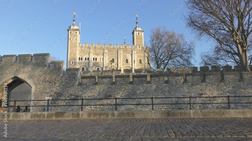 An ancient stone castle on the river bank.