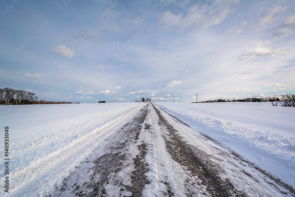 Snow covered road in a rural area of York County, Pennsylvania.