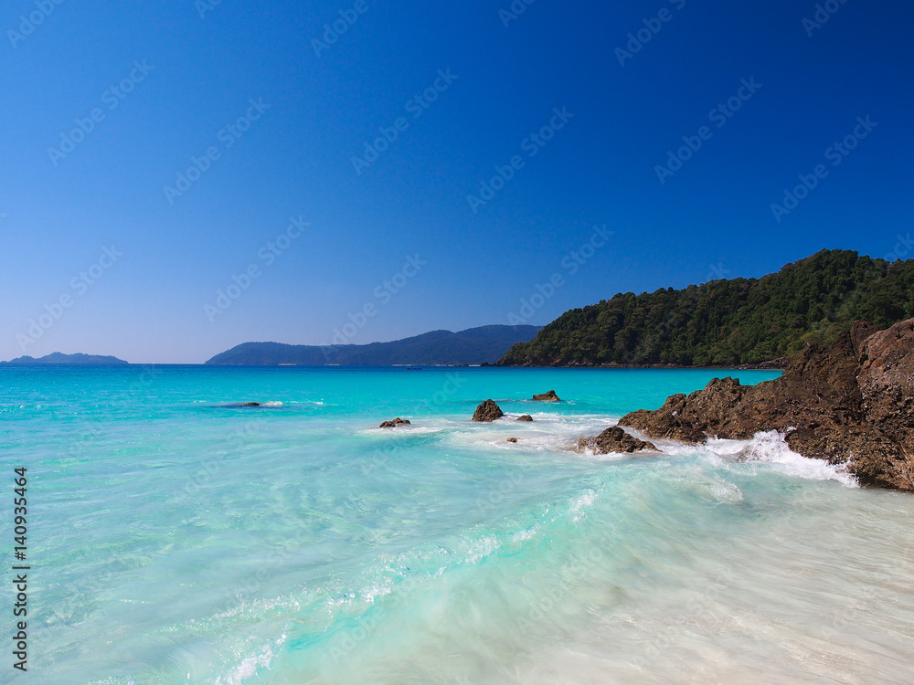 Sea and white sand with clear blue sky in Myanmar.