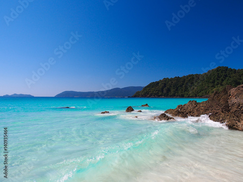 Sea and white sand with clear blue sky in Myanmar. © pada smith