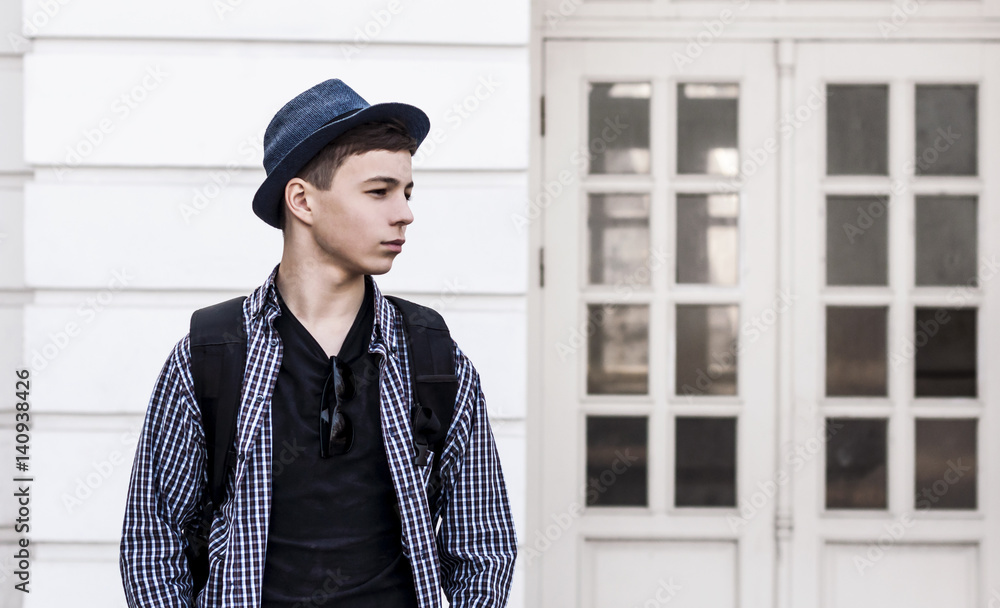 Stylish young man near the doors of the building Stylish young man near the doors of the building