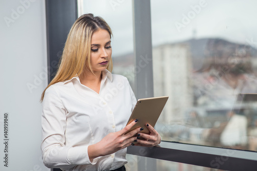 Young attractive female in business officce 