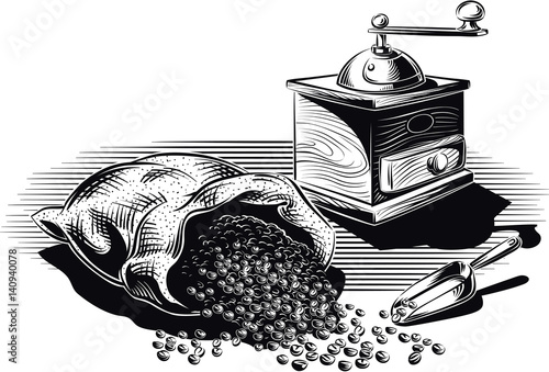 Lots of roasted coffee opened and an old coffee grinder.