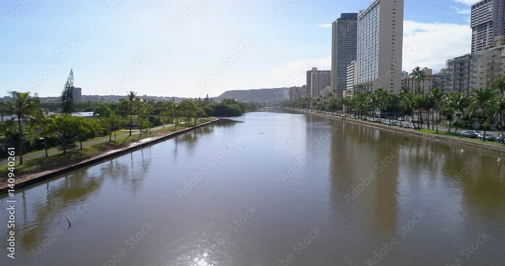 Slow motion aerial Ala Wai Canal Honolulu Hawaii Slow motion aerial Ala Wai Canal Honolulu Hawaii