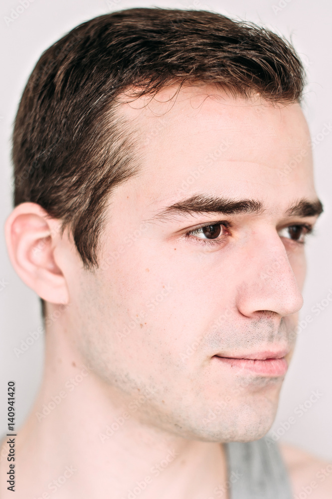 Close up portrait of a handsome young man on white