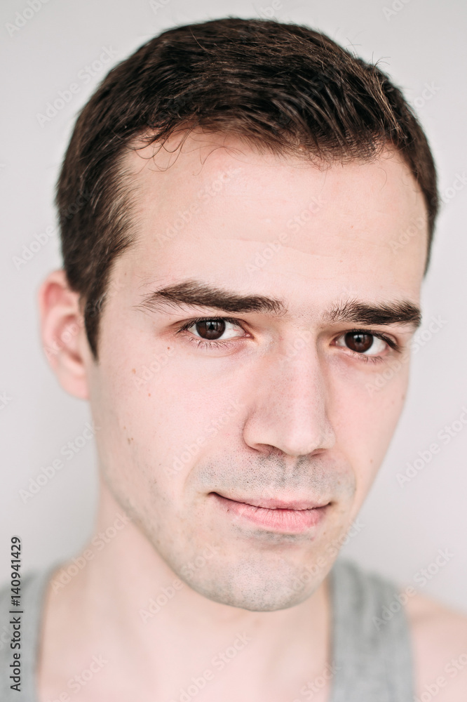 Close up portrait of a handsome young man on white Close up portrait of a handsome young man on white