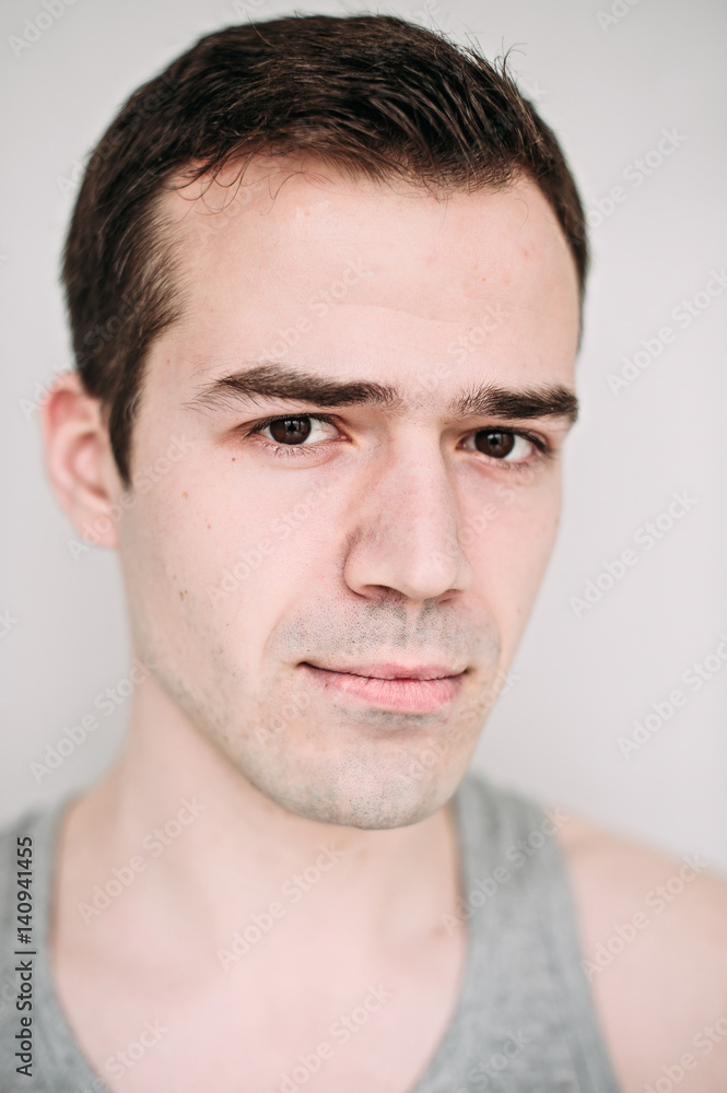Close up portrait of a handsome young man on white Close up portrait of a handsome young man on white