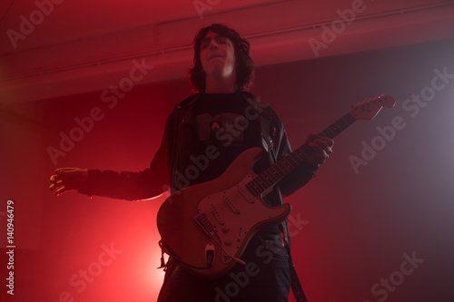 Fototapeta Naklejka Na Ścianę i Meble -  Guitarist Playing His Guitar