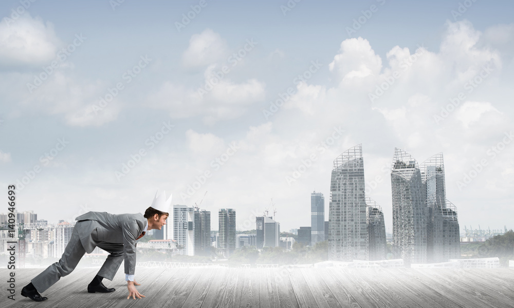 King businessman in elegant suit running and modern cityscape at background