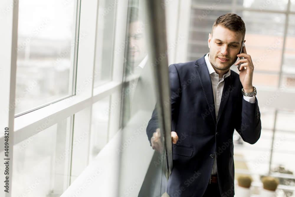 Businessman having phone call in the office Businessman having phone call in the office