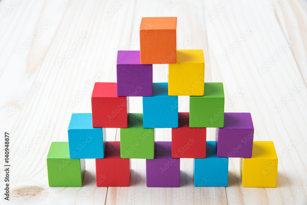 Colorful stack of wood cube building blocks