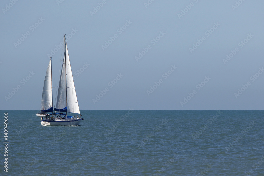 A sailboat cruising across the Gulf of Mexico near St. Pete Beach, Florida.