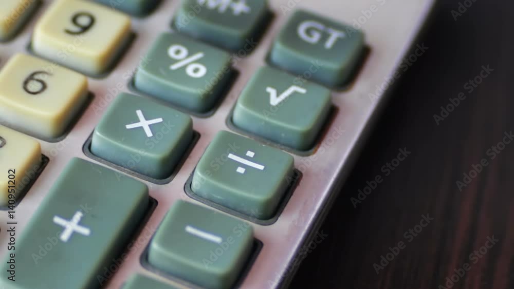 Businessman Counting On a Old Calculator close up Businessman Counting On a Old Calculator close up
