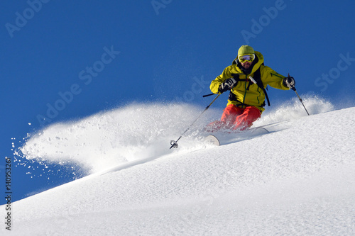 Man skiing on snowy mountain landscape