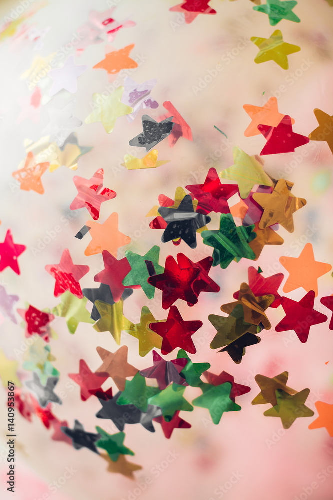background of colorful confetti stars
