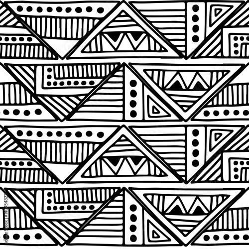 Seamless vector pattern. Black and white geometrical background with hand drawn decorative tribal elements. Print with ethnic  folk  traditional motifs. Graphic vector illustration.