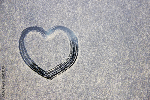 Painted on snow-covered glass heart