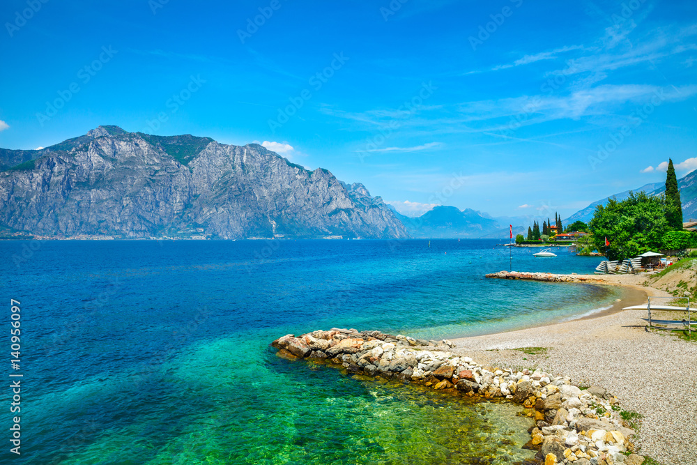 Summer embankment and beach landscape of Garda lake with high - obrazy, fototapety, plakaty 