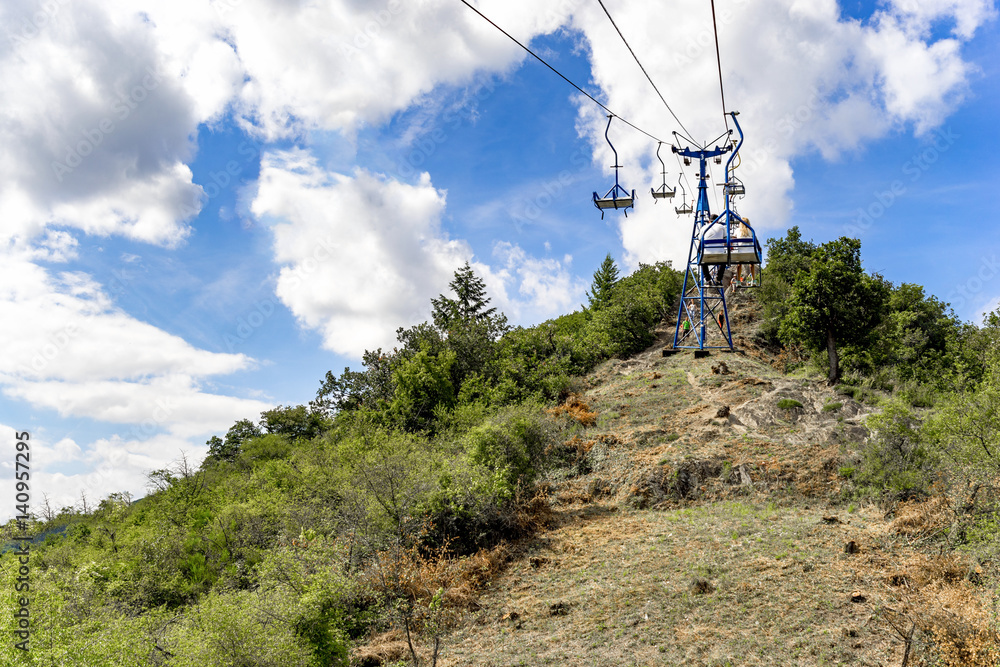 Chairlift on a sunny day and blue sky Chairlift on a sunny day and blue sky