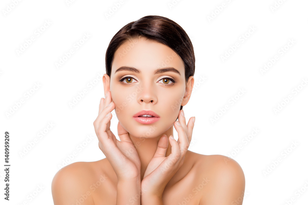 Portrait of young pretty lady with perfect skin gently touching her face Portrait of young pretty lady with perfect skin gently touching her face