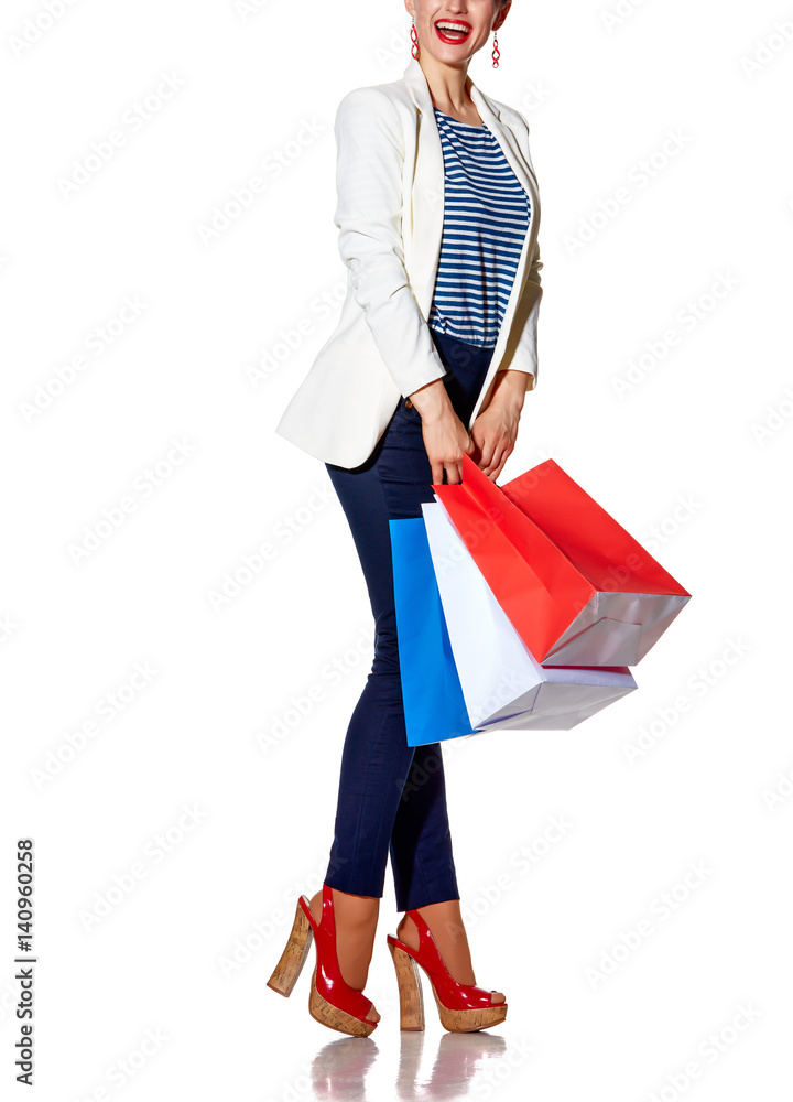 Excited young woman with shopping bags looking on copy space Excited young woman with shopping bags looking on copy space