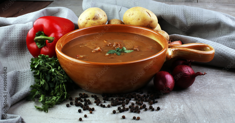 Tasty Hungarian beef goulash soup bograch close-up on the table and ingredient Tasty Hungarian beef goulash soup bograch close-up on the table and ingredient