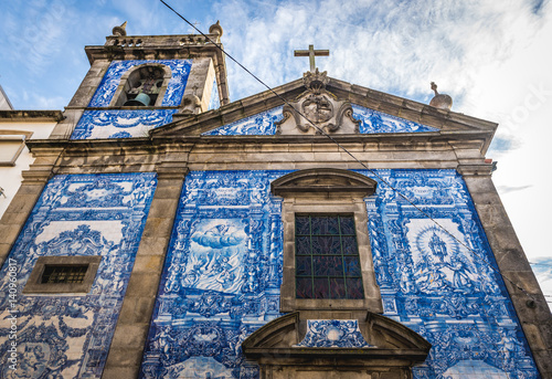 Characteristic tilework called Azulejo on Capela das Almas church in Porto, Portugal photo