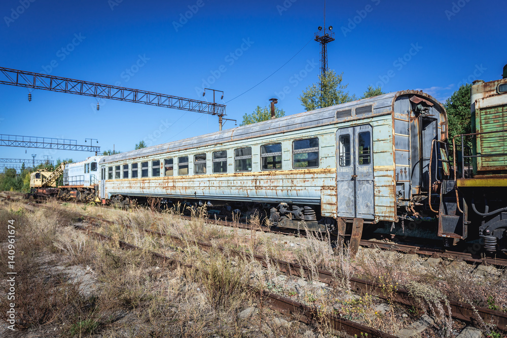 Obraz premium Train on deserted Yaniv railroad station near Pripyat city in Chernobyl Exclusion Zone, Ukraine